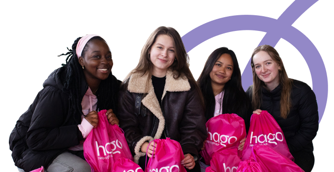 Four teens holding pink hago bags